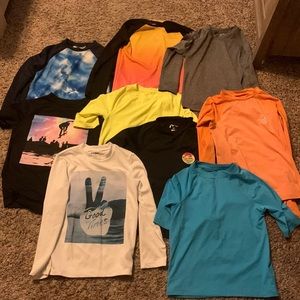 9 swim shirts, boys medium. 8-10 size